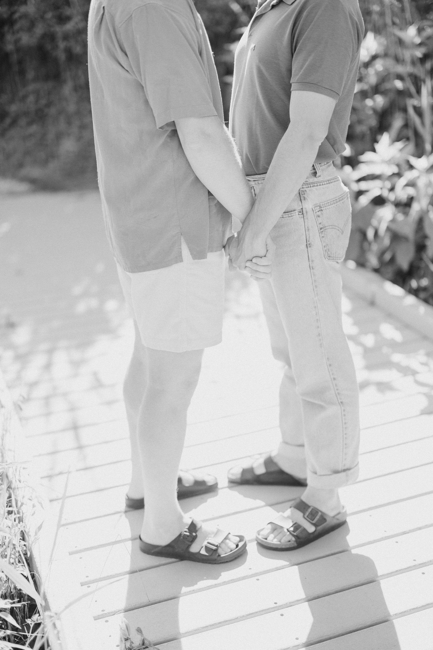 LGBTQ+ couple holding hands at engagement session
